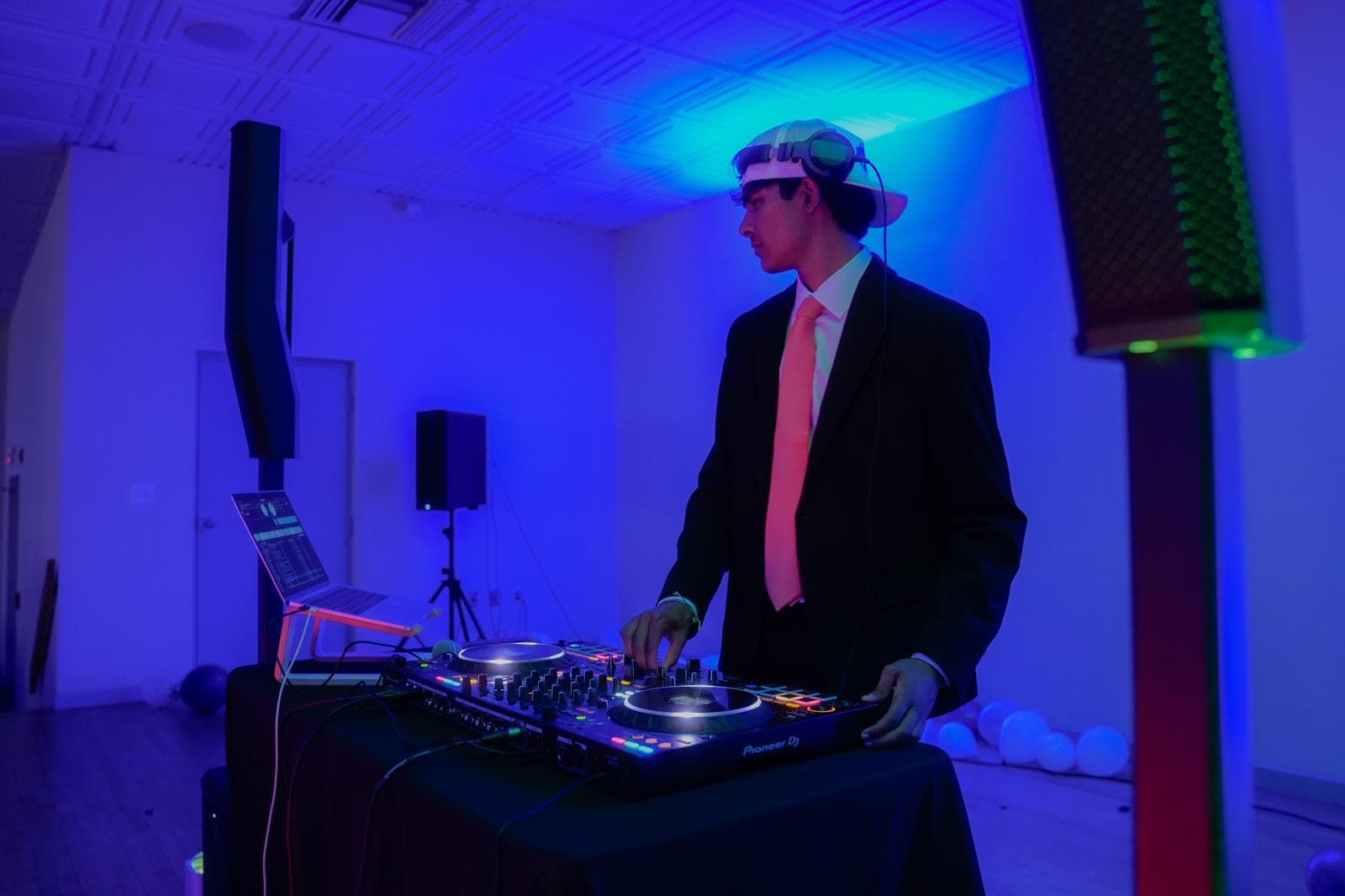 [RCC] DJ performing under blue stage lighting