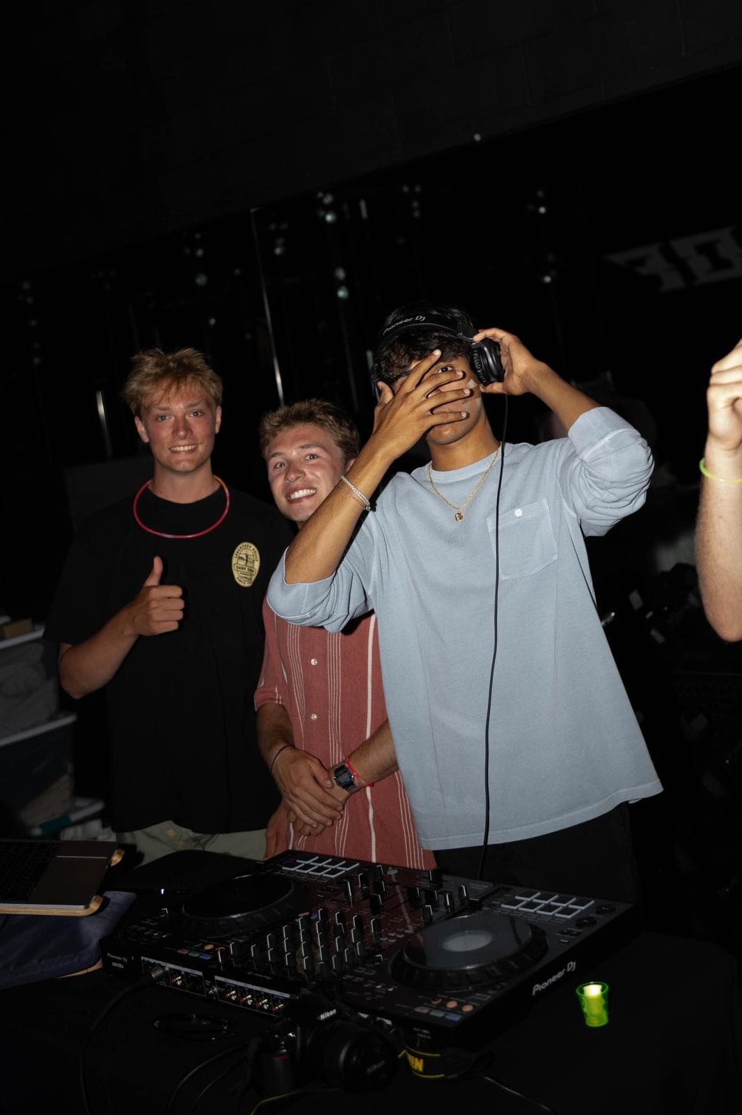 DJ laughing with friends